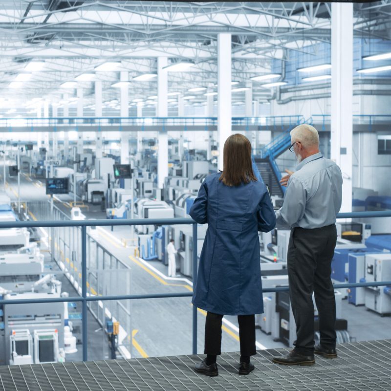 Feature male and female engineers manufacturing waste management case study