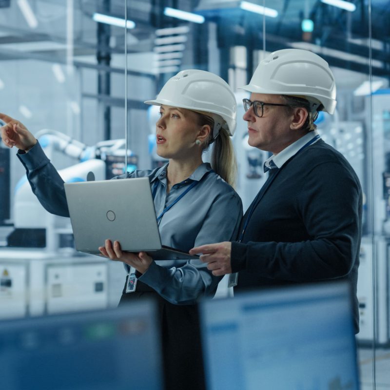 Future of waste management manufacturing engineer and technician in conversation using portal on laptop feature image